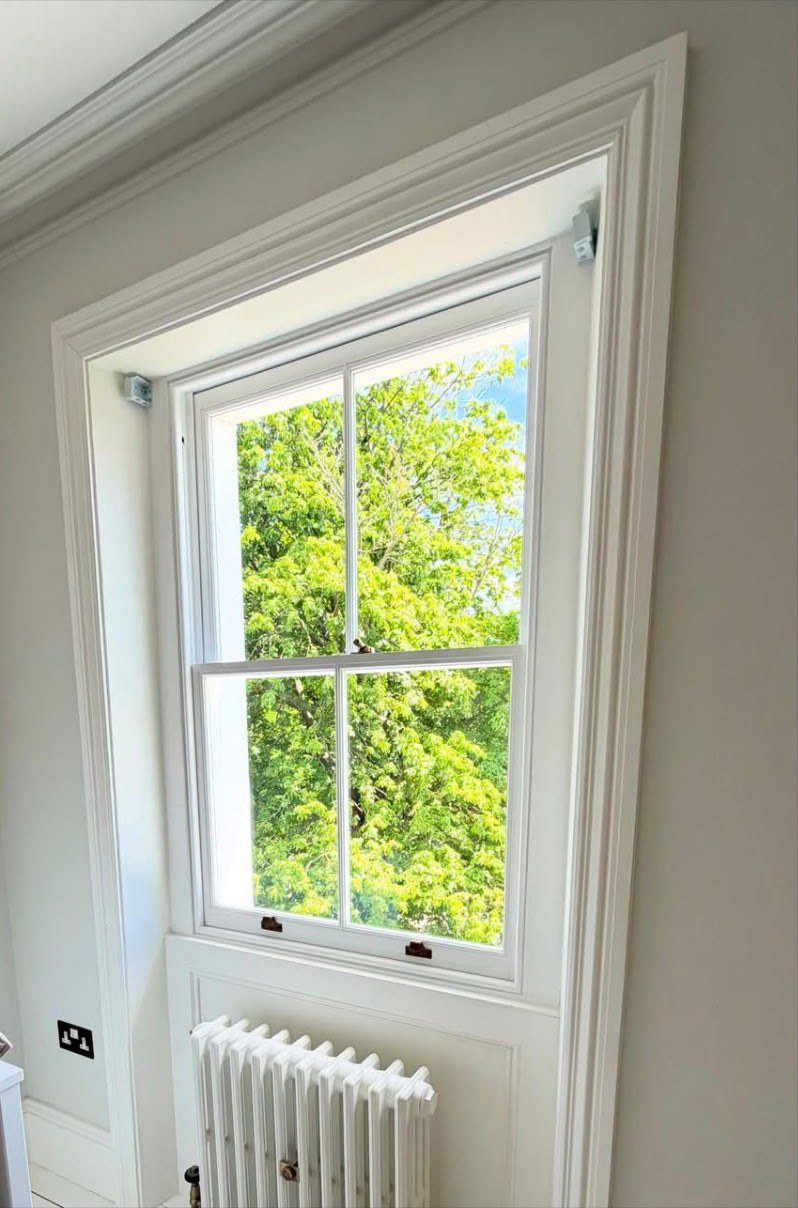 Fully restored sash window above a radiator